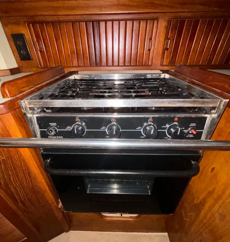 Slide: The Image of 1987 Island Packet 38 sailboat kitchen with a Princess stove and oven. - 6