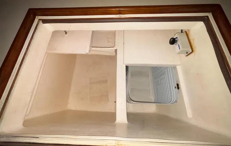 Slide: The Image of Interior storage compartment of a 1987 Island Packet 38 sailboat. - 8