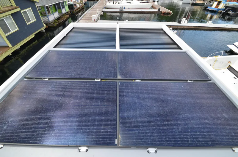 Slide: The Image of Solar panels on La Mare Modern 11 houseboat, 2024 model, docked at marina. - 37