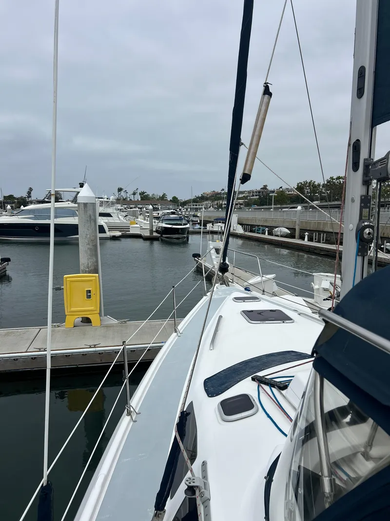 Slide: The Image of 2000 Hunter Passage 420 sailboat docked in a marina, surrounded by other boats. - 13