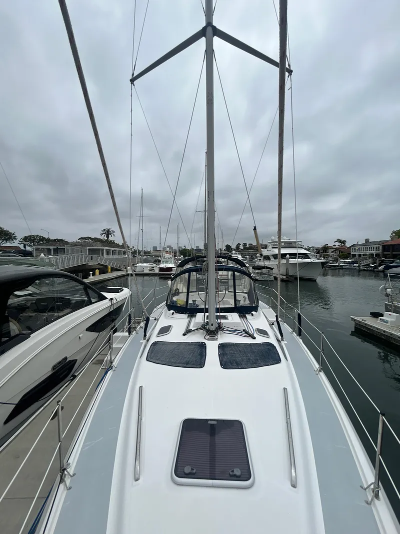 Slide: The Image of 2000 Hunter Passage 420 sailboat docked in a marina, overcast sky. - 14