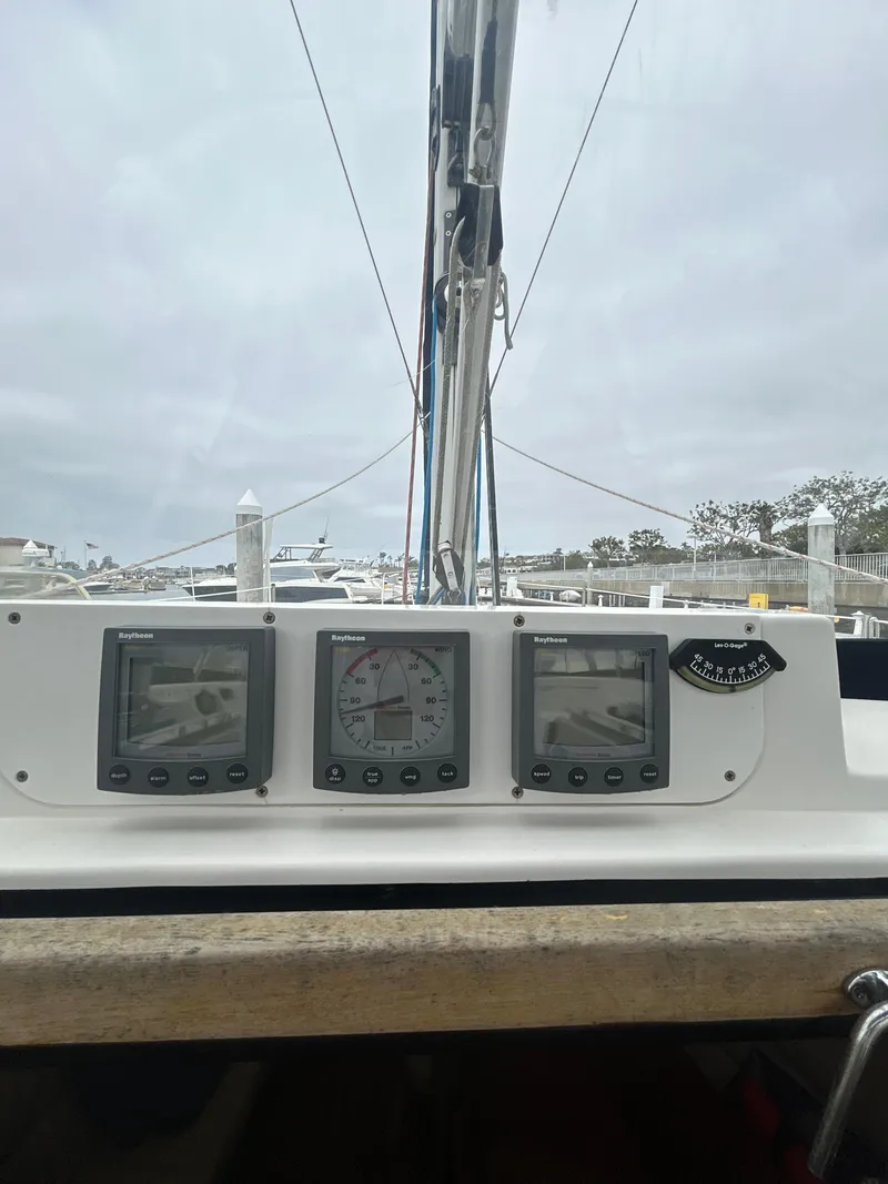 Slide: The Image of Control panel of a 2000 Hunter Passage 420 sailboat with navigation instruments. - 18