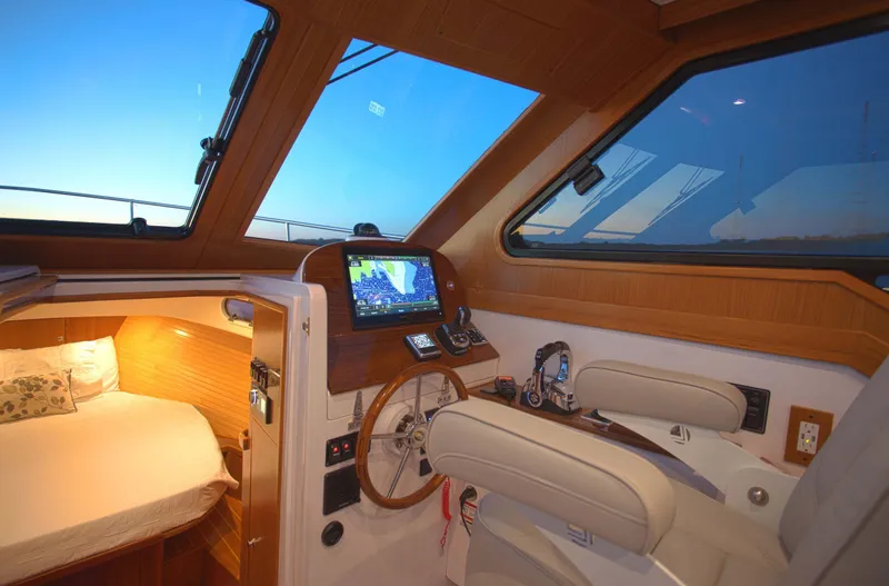 Slide: The Image of Luxurious 2024 True North 34 yacht interior with navigation system and cozy cabin. - 2