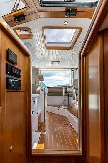 Slide: The Image of Interior of 2024 True North 34 boat with wooden finish and skylights. - 9