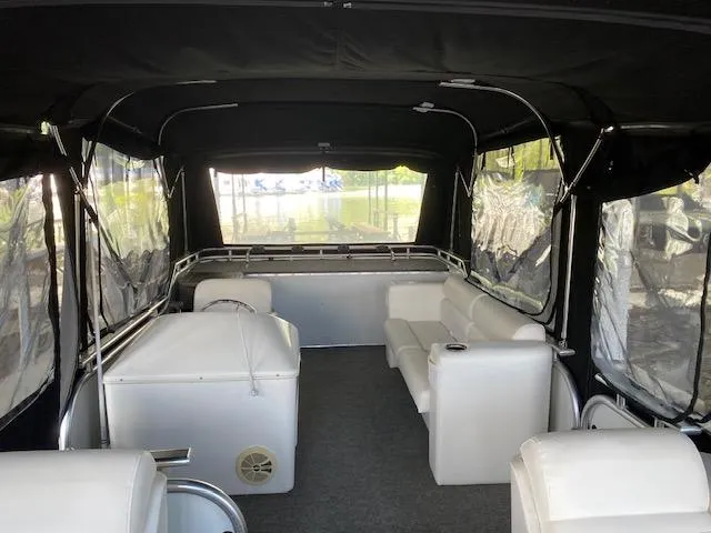 Slide: The Image of Interior of 1988 Sun Tracker PARTY BARGE with seating and canopy. - 12