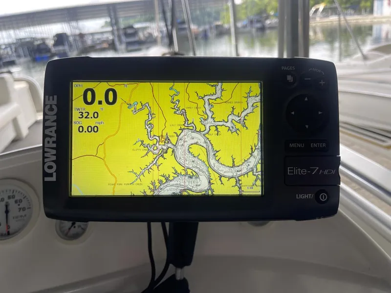 Slide: The Image of Lowrance Elite-7 HDI fishfinder displaying a detailed waterway map on a Sun Tracker PARTY BARGE. - 20
