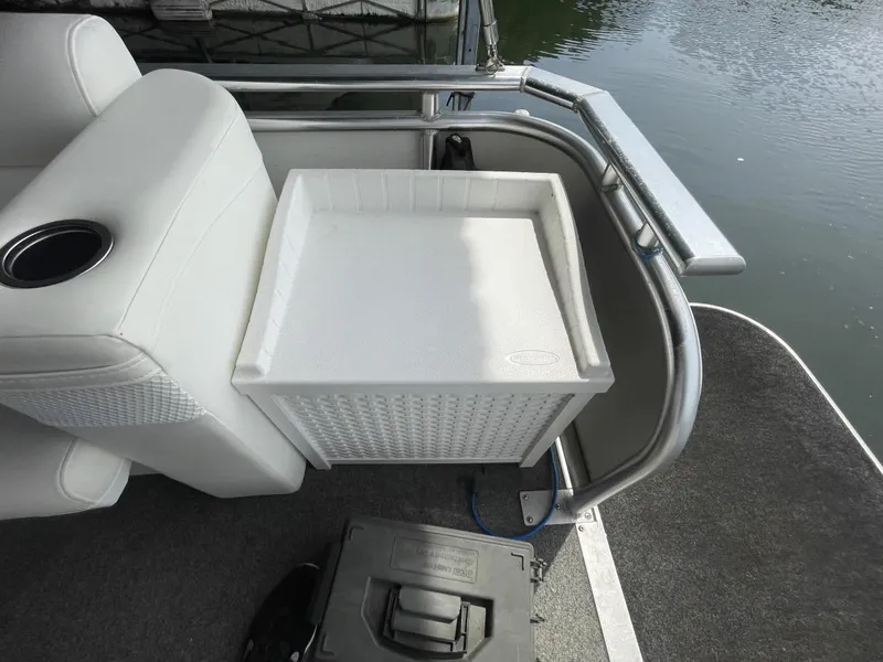 Slide: The Image of 1988 Sun Tracker PARTY BARGE with white seating and storage box on deck. - 27