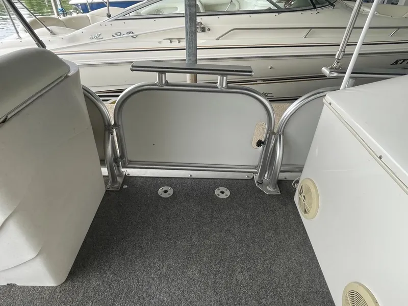 Slide: The Image of Interior of a 1988 Sun Tracker PARTY BARGE with carpeted floor and seating. - 32