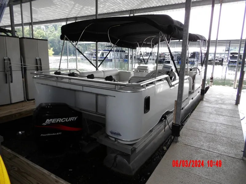 Slide: The Image of 1988 Sun Tracker PARTY BARGE pontoon boat docked with Mercury outboard motor. - 7