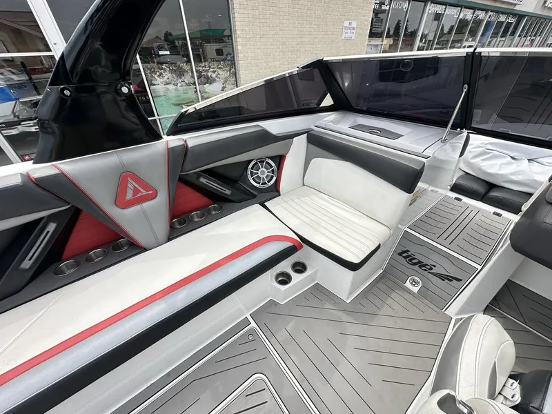 Slide: The Image of 2014 Tigé ASR boat interior with sleek seating, modern design, and branded flooring. - 22