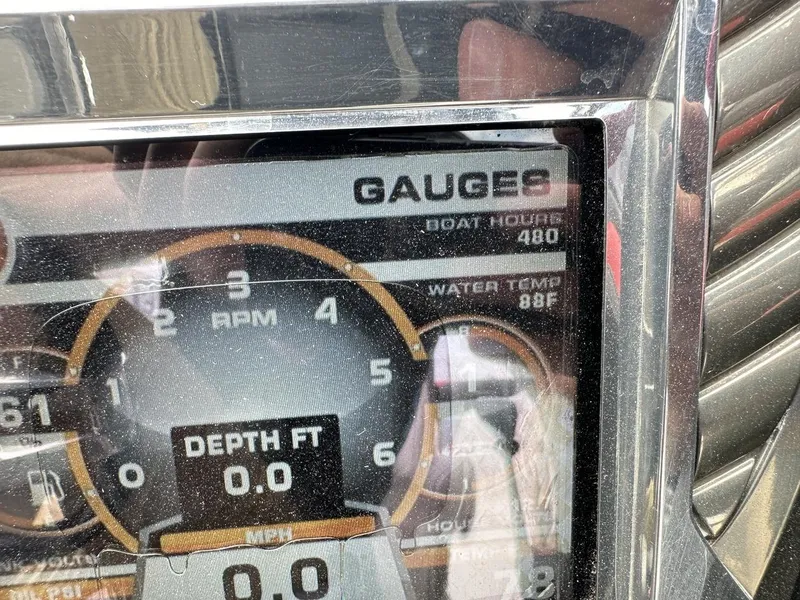 Slide: The Image of Close-up of 2014 Tigé ASR boat dashboard showing gauges, 480 hours, 88°F water temperature. - 26