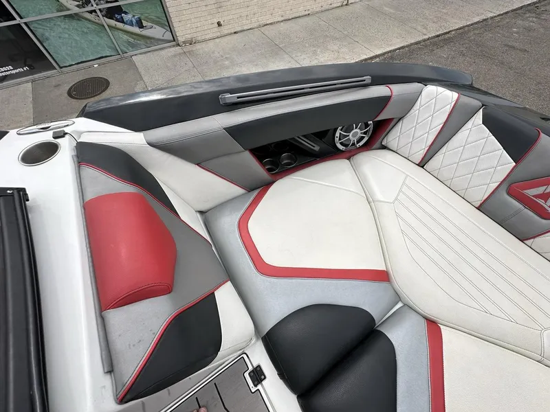 Slide: The Image of 2014 Tigé ASR boat interior with red, white, and gray upholstery. - 29