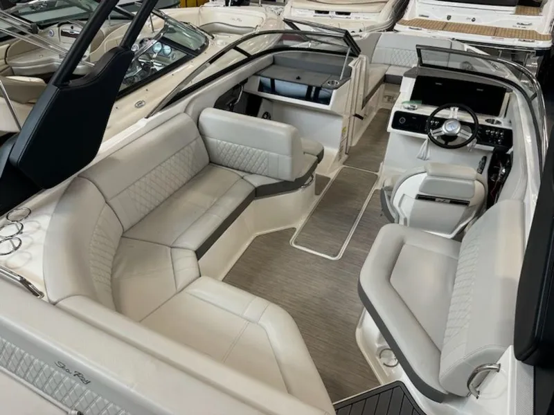 Slide: The Image of 2020 Sea Ray SLX 230 boat interior with luxurious seating and modern dashboard. - 3