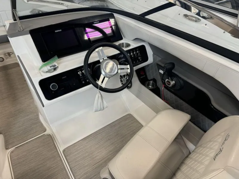 Slide: The Image of 2020 Sea Ray SLX 230 boat cockpit with modern steering and controls. - 4