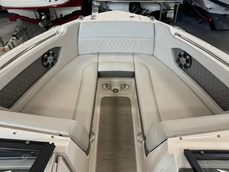 Slide: The Image of 2020 Sea Ray SLX 230 boat interior with luxurious seating and speakers. - 5