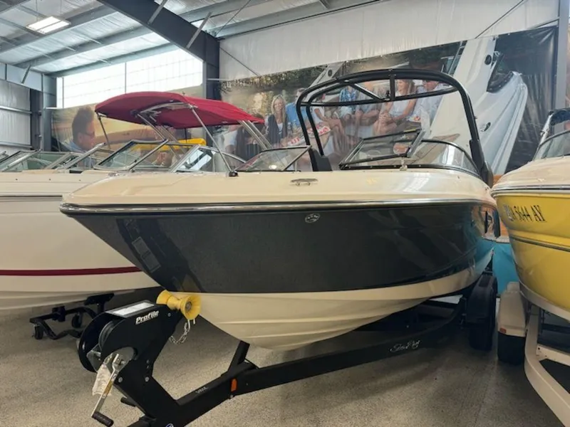 Slide: The Image of 2020 Sea Ray SLX 230 boat displayed in a showroom. - 9