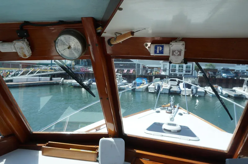 Slide: The Image of View from the cabin of a 2000 Webbers Cove 26 Pemaquid Beach boat in a marina. - 15