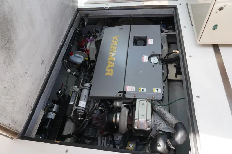 Slide: The Image of Engine compartment of 2000 Webbers Cove 26 Pemaquid Beach boat with Yanmar engine. - 24
