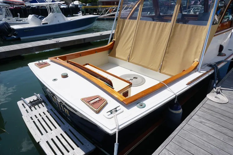 Slide: The Image of Webbers Cove 26 Pemaquid Beach boat, 2000 model, docked at marina with beige canopy. - 6