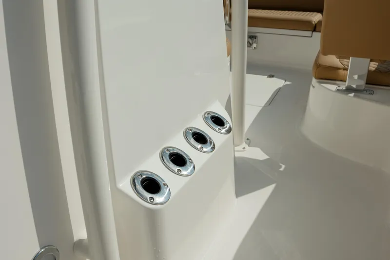Slide: The Image of 2025 Caymas 26 HB boat interior with rod holders and seating. - 24