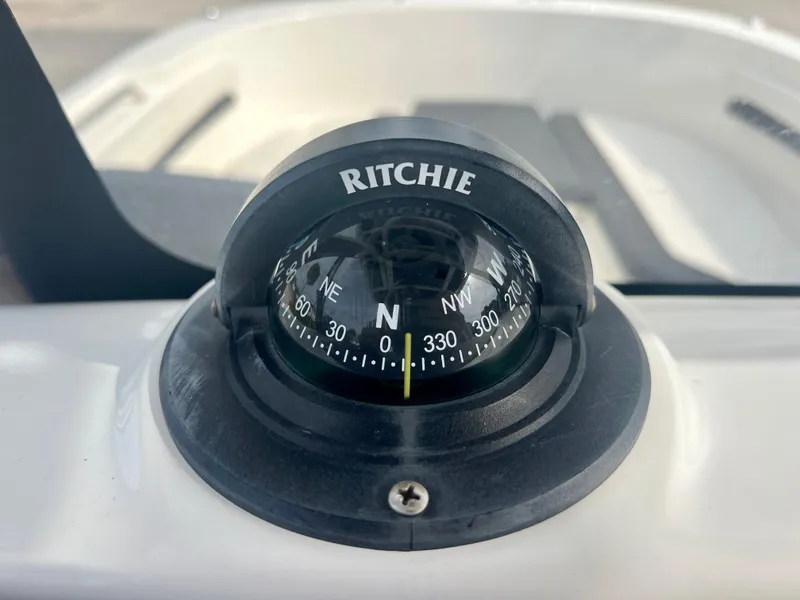Slide: The Image of Ritchie compass on 2023 Trophy T24CC boat dashboard. - 18