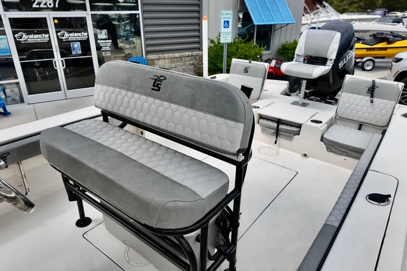 Slide: The Image of 2025 Carolina Skiff 26 Ultra Elite boat interior with gray seating and modern design. - 11