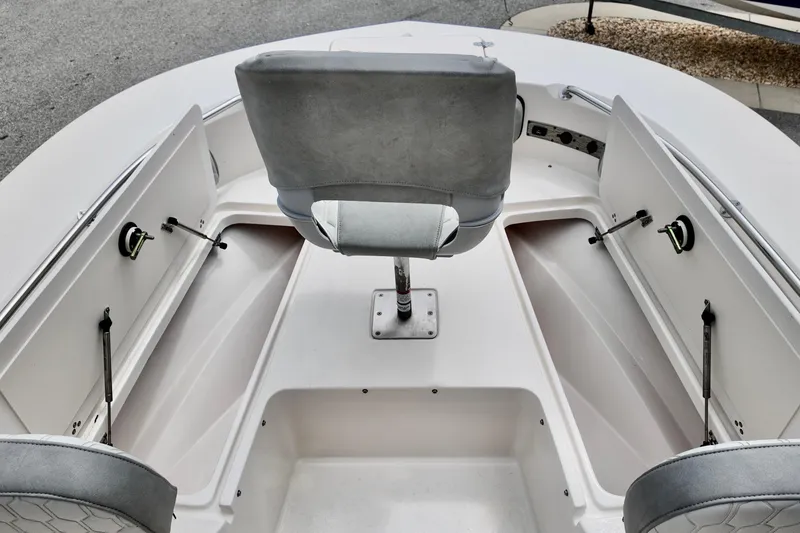 Slide: The Image of 2025 Carolina Skiff 26 Ultra Elite boat interior with seating and storage compartments. - 13