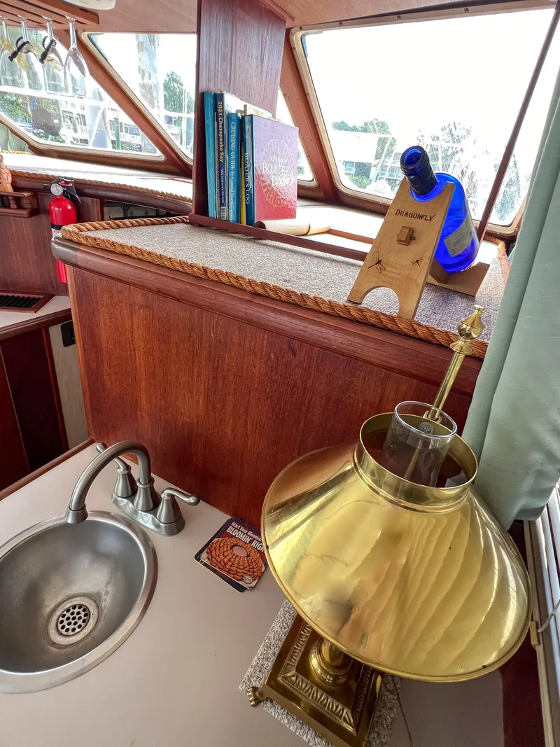 Slide: The Image of Interior of 1987 Tollycraft 34 Sport Sedan with brass lamp and sink. - 30