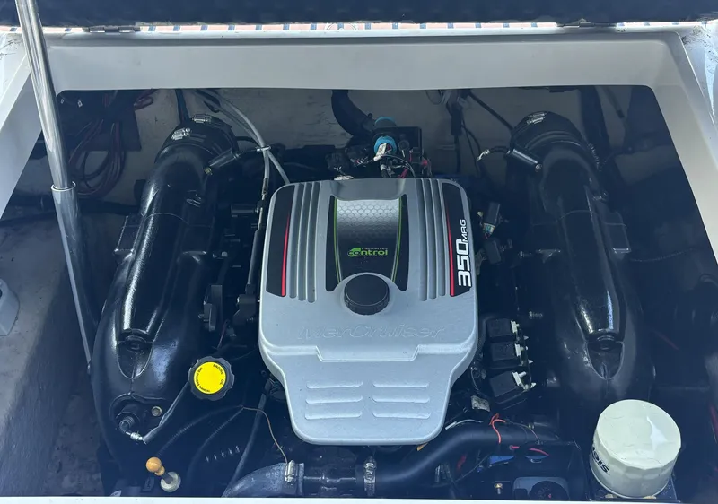 Slide: The Image of 2014 Starcraft SCX 230 engine compartment with powerful inboard motor. - 10