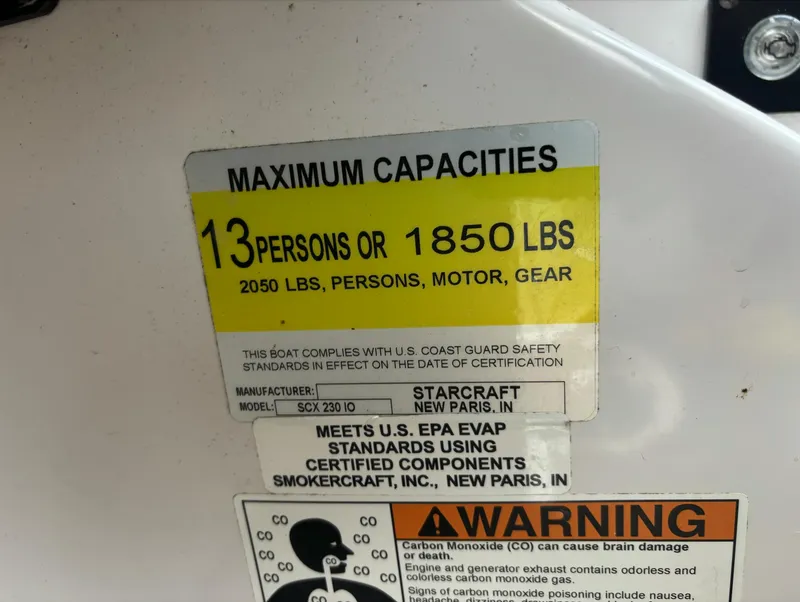 Slide: The Image of Starcraft SCX 230 2014 capacity label: 13 persons or 1850 lbs, safety warning included. - 18