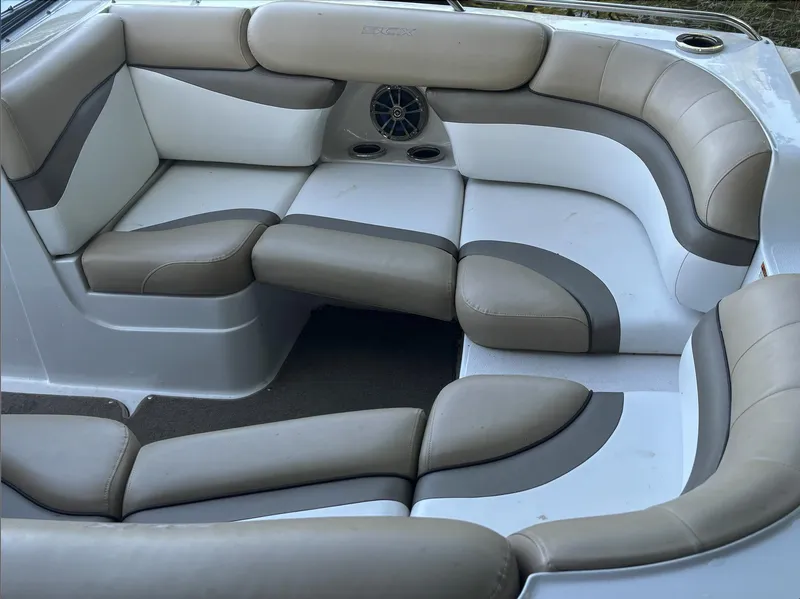 Slide: The Image of 2014 Starcraft SCX 230 boat interior with beige and white cushioned seating. - 3