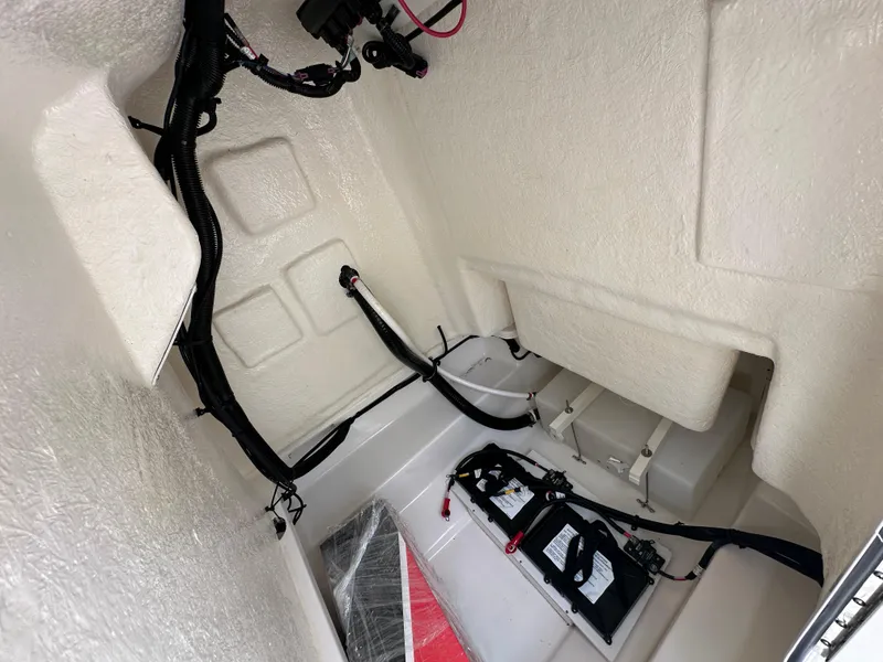 Slide: The Image of 2024 Bayliner Trophy T20CC interior wiring and battery compartment. - 8