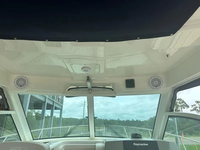 Slide: The Image of Interior view of 2016 Boston Whaler 315 Conquest boat with Raymarine equipment. - 18