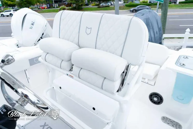 Slide: The Image of 2025 Sea Fox 228 Commander Center Console with luxurious white seating and modern design. - 14
