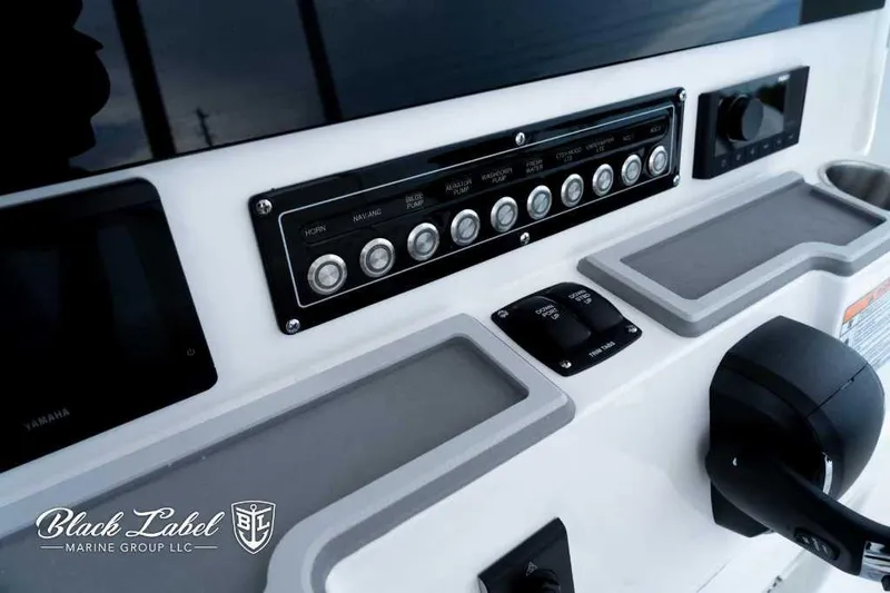 Slide: The Image of Control panel of 2025 Sea Fox 228 Commander Center Console boat, featuring switches and controls. - 18