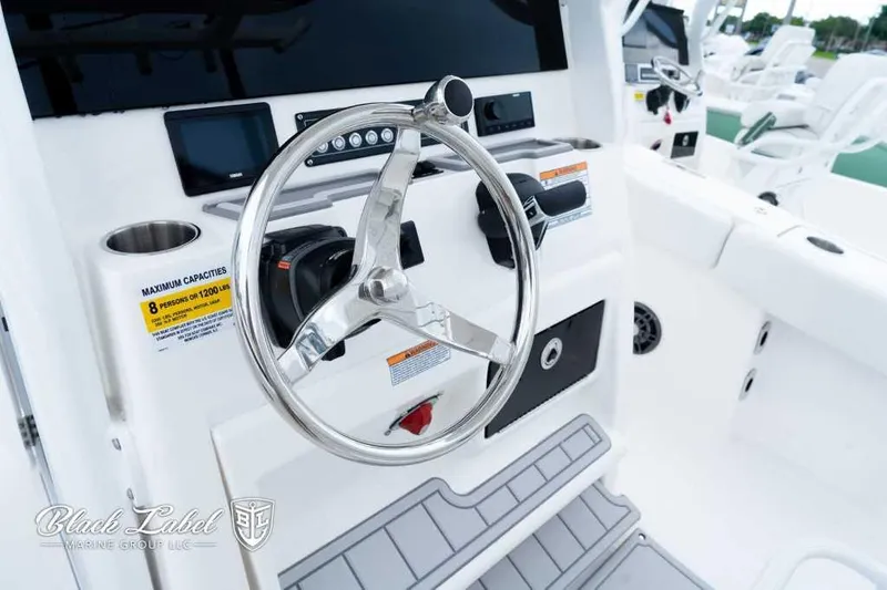 Slide: The Image of 2025 Sea Fox 228 Commander Center Console steering wheel and dashboard close-up. - 19