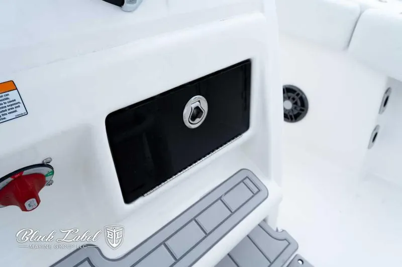 Slide: The Image of 2025 Sea Fox 228 Commander Center Console interior detail with storage compartment and control panel. - 20