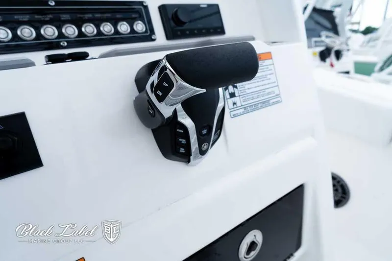 Slide: The Image of 2025 Sea Fox 228 Commander Center Console throttle controls and dashboard close-up. - 21