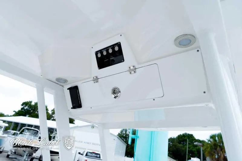 Slide: The Image of 2025 Sea Fox 228 Commander Center Console dashboard with controls and storage compartment. - 24