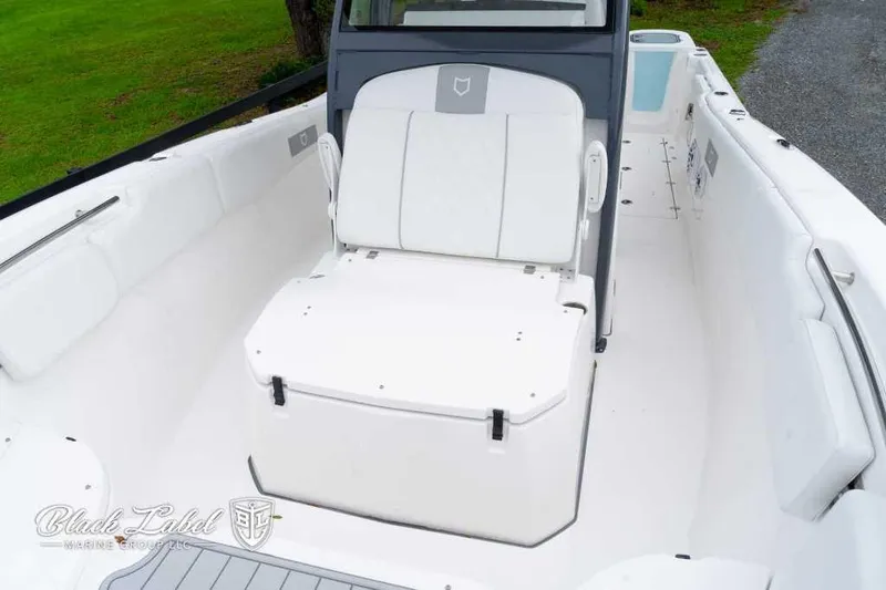 Slide: The Image of 2025 Sea Fox 288 Commander Center Console boat interior with seating and storage. - 10