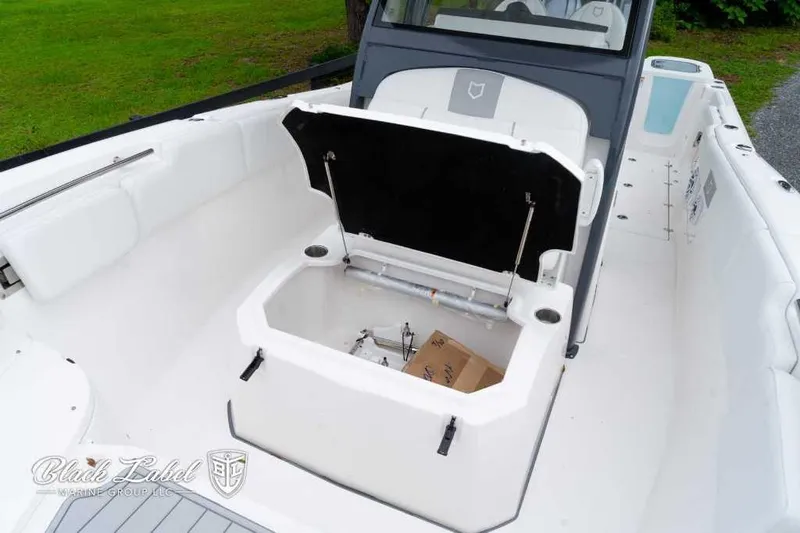 Slide: The Image of 2025 Sea Fox 288 Commander Center Console boat with open storage compartment. - 11