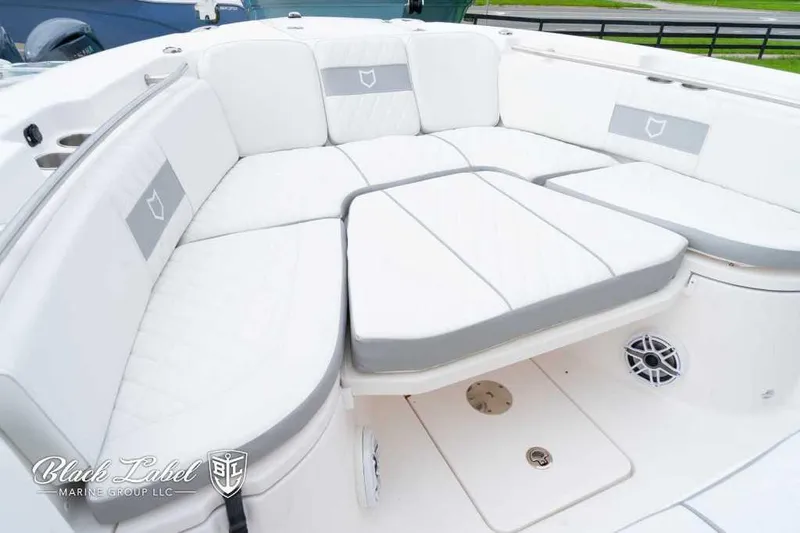 Slide: The Image of 2025 Sea Fox 288 Commander Center Console boat with luxurious white seating. - 12