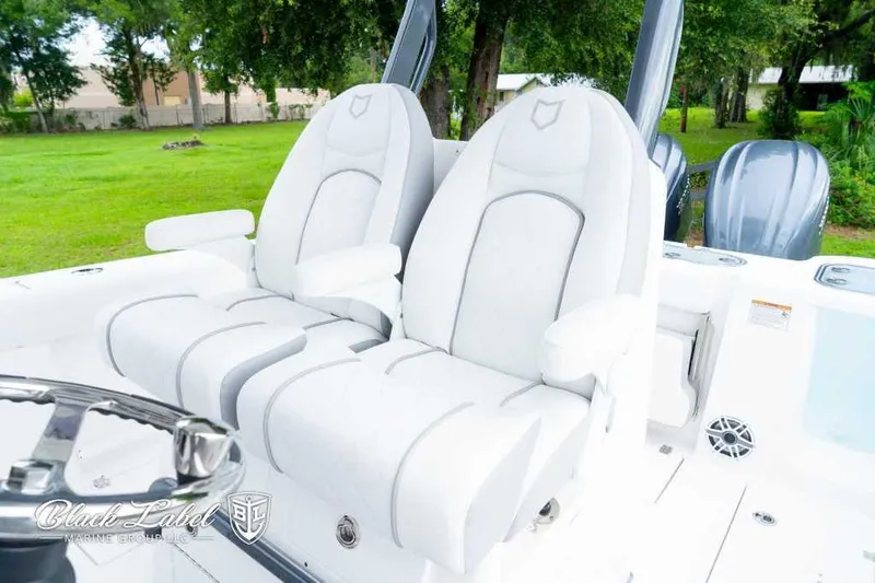 Slide: The Image of 2025 Sea Fox 288 Commander Center Console with luxurious white seating and dual engines. - 18