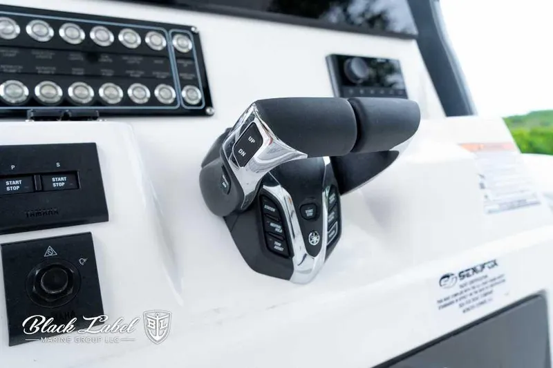 Slide: The Image of Close-up of 2025 Sea Fox 288 Commander Center Console controls and dashboard. - 23