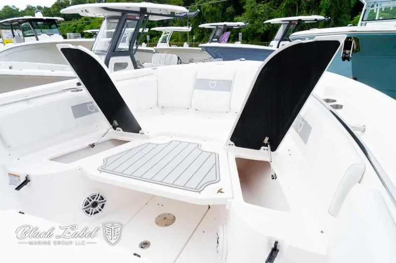 Slide: The Image of 2025 Sea Fox 288 Commander Center Console boat interior with open storage compartments. - 8