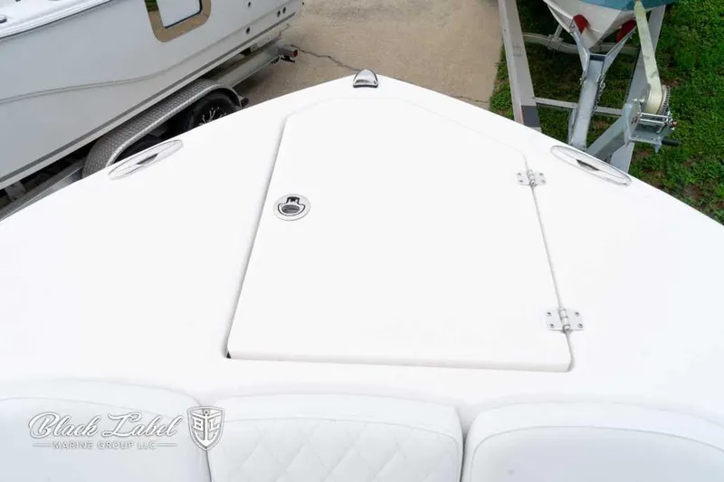 Slide: The Image of 2025 Sea Fox 288 Commander Center Console boat deck, featuring storage hatch. - 9