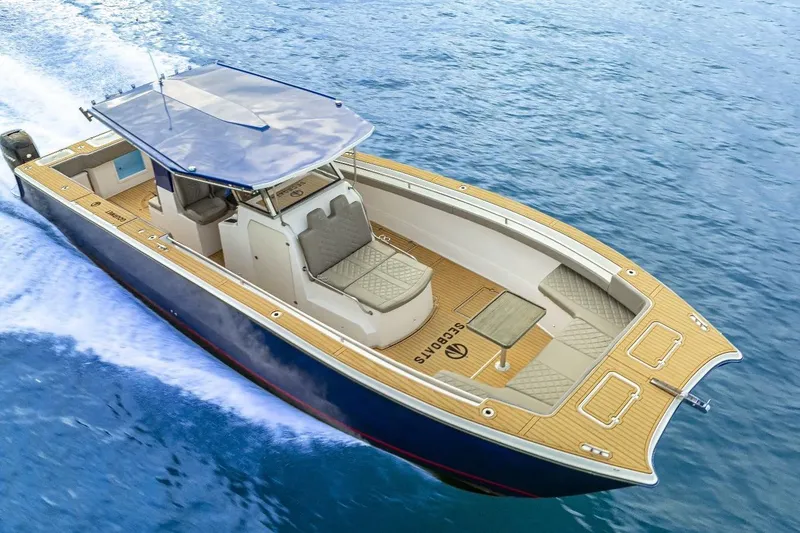 Slide: The Image of Custom 2024 Catamaran SET CAT cruising on blue ocean waters. - 100