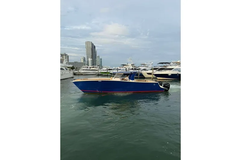 Slide: The Image of Custom 2024 Catamaran SET CAT in marina, with city skyline background. - 102