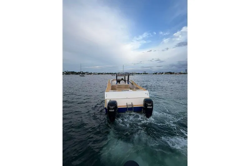 Slide: The Image of 2024 Custom Catamaran SET CAT on water with dual 400 horsepower engines. - 114