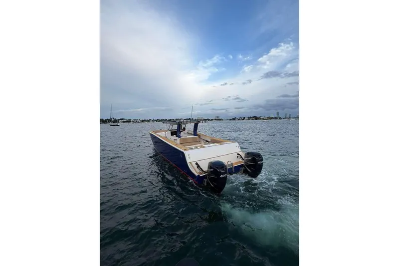 Slide: The Image of Custom 2024 Catamaran SET CAT with dual engines on open water. - 16